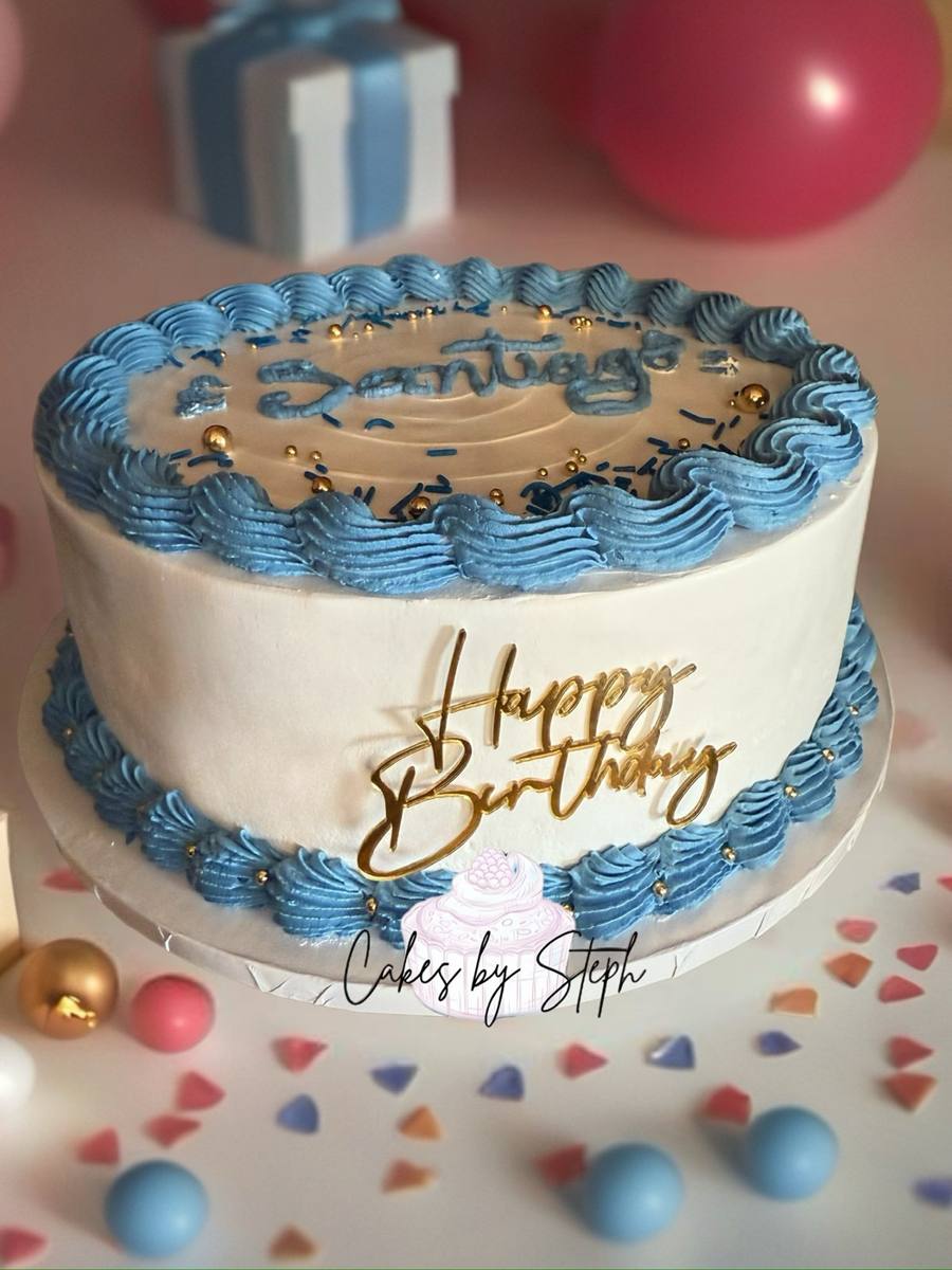 White cake, blue piping, gold Happy Birthday topper, name Santiago by Cakes by Steph, Leesburg VA