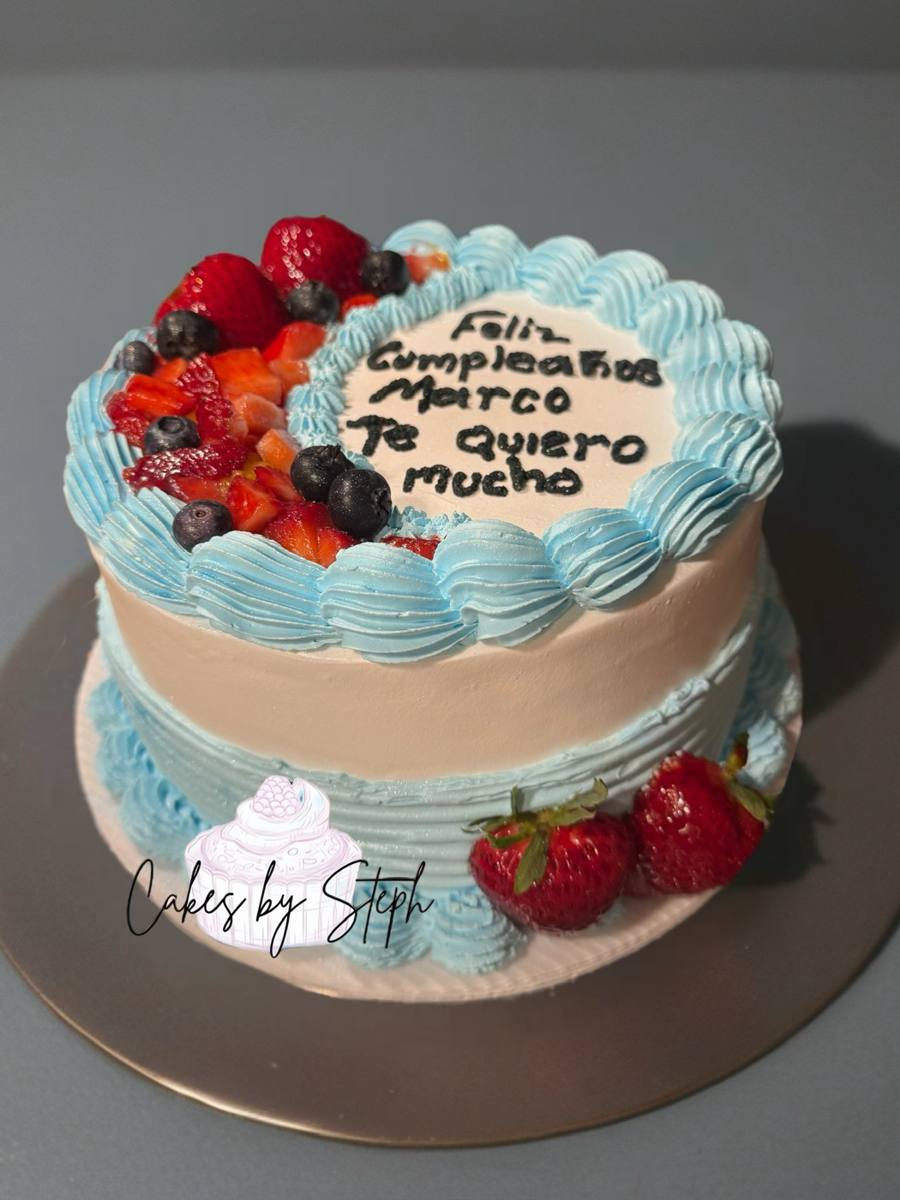 Blue-trimmed cake with berries, Feliz Cumpleanos Marco greeting by Cakes by Steph, Leesburg VA