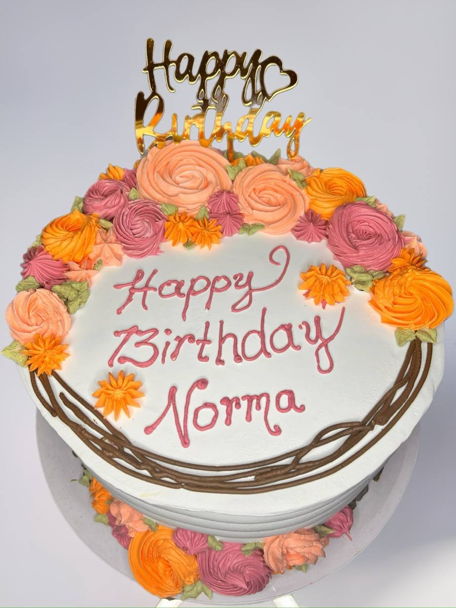 White cake, pink and orange buttercream roses, "Happy Birthday Norma" by Cakes by Steph, Leesburg VA
