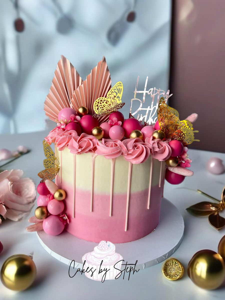 Tall pink and gold drip cake with butterflies by Cakes by Steph