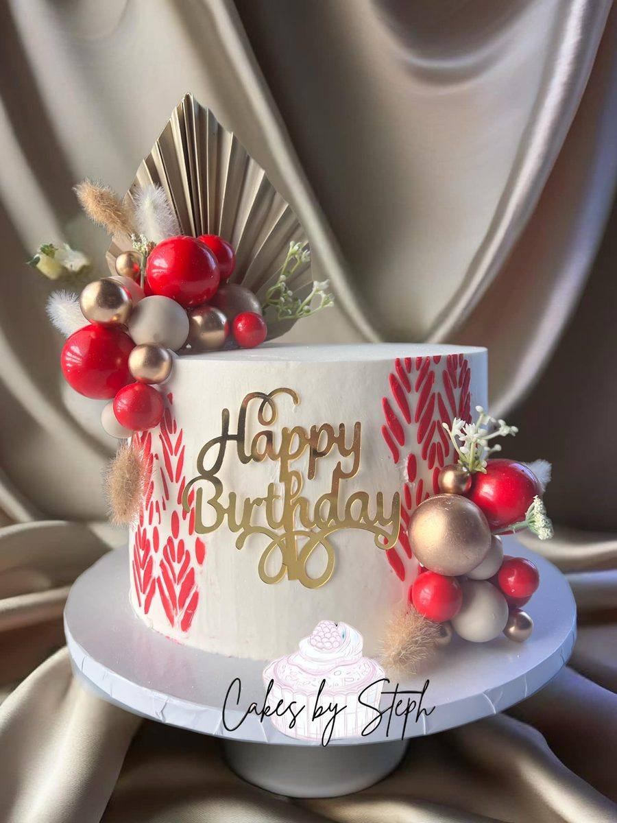 White buttercream birthday cake with red and rose gold spheres by Cakes by Steph, Leesburg VA