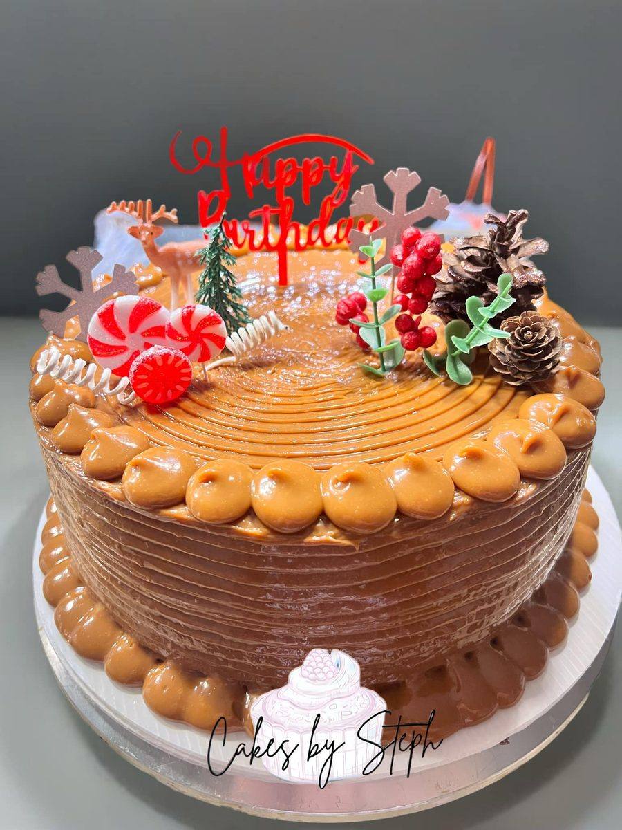 Caramel dulce de leche cake with winter pinecones and berries by Cakes by Steph, Leesburg VA