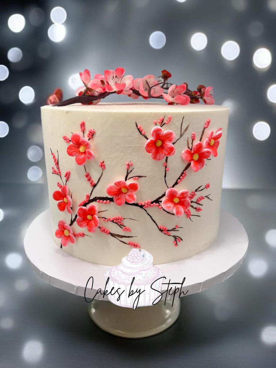 Hand painted red cherry blossom cake by Cakes by Steph