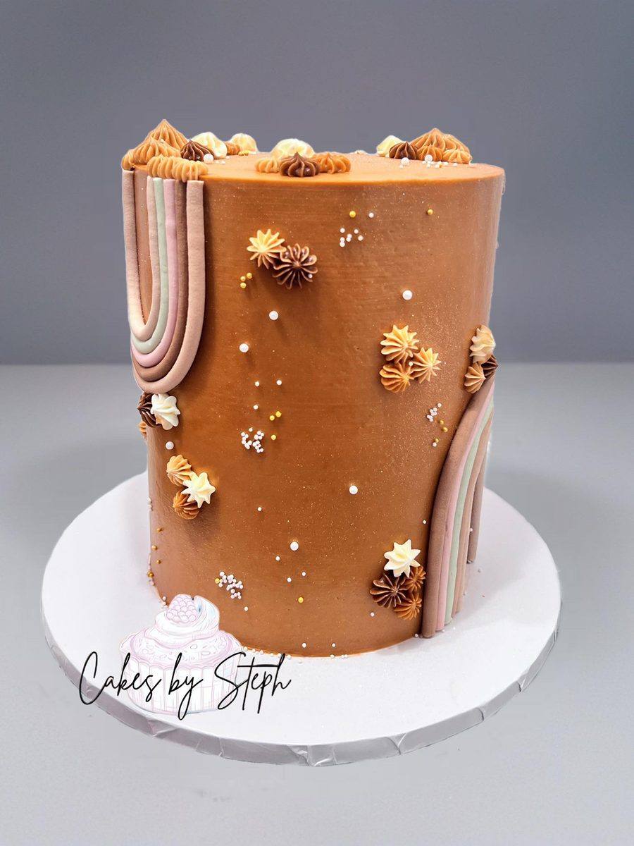 Tall terracotta boho cake with piped rainbow by Cakes by Steph, Leesburg VA