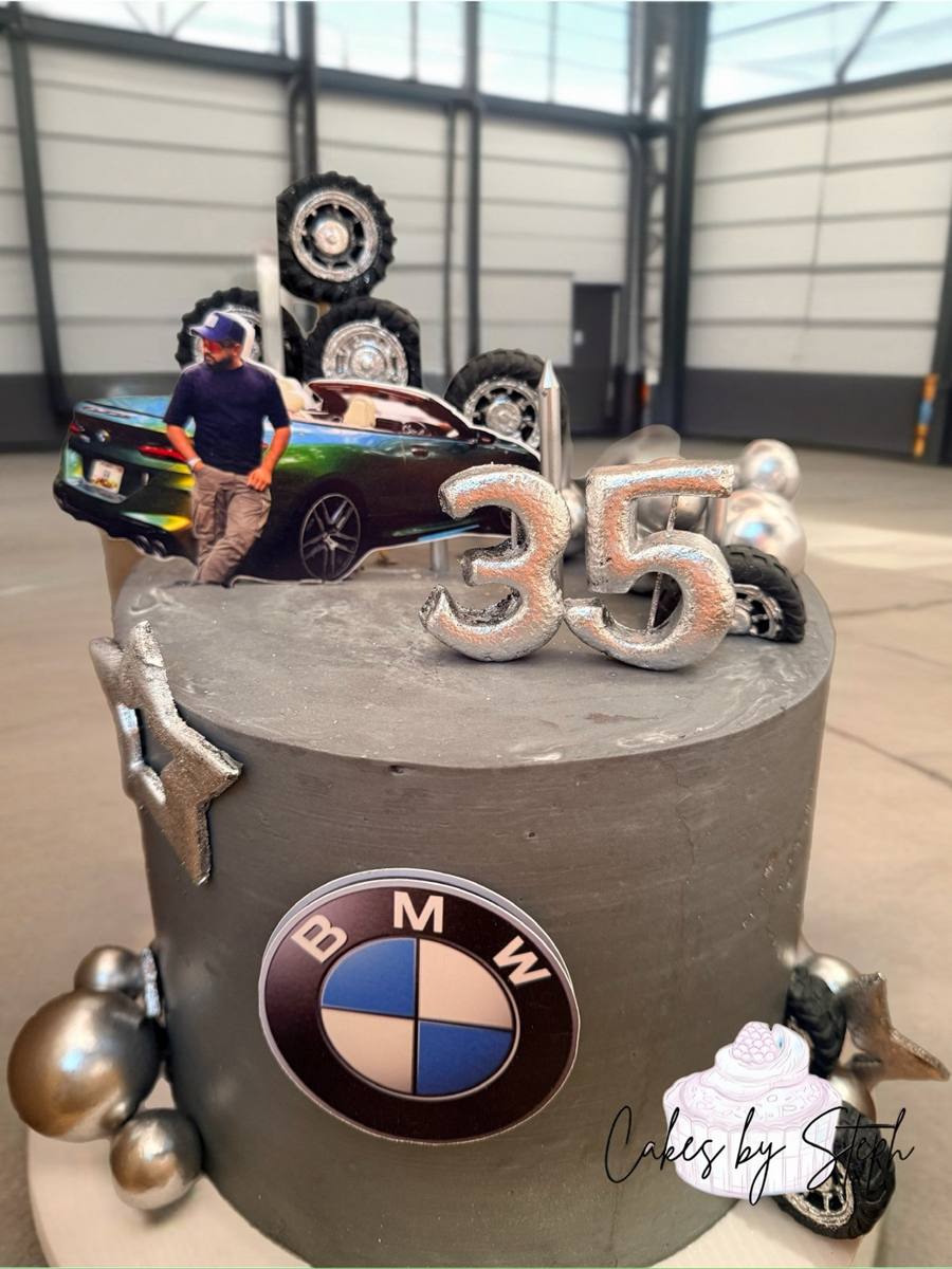 Gray BMW-themed cake with silver 35, car photo and tires by Cakes by Steph, Leesburg VA