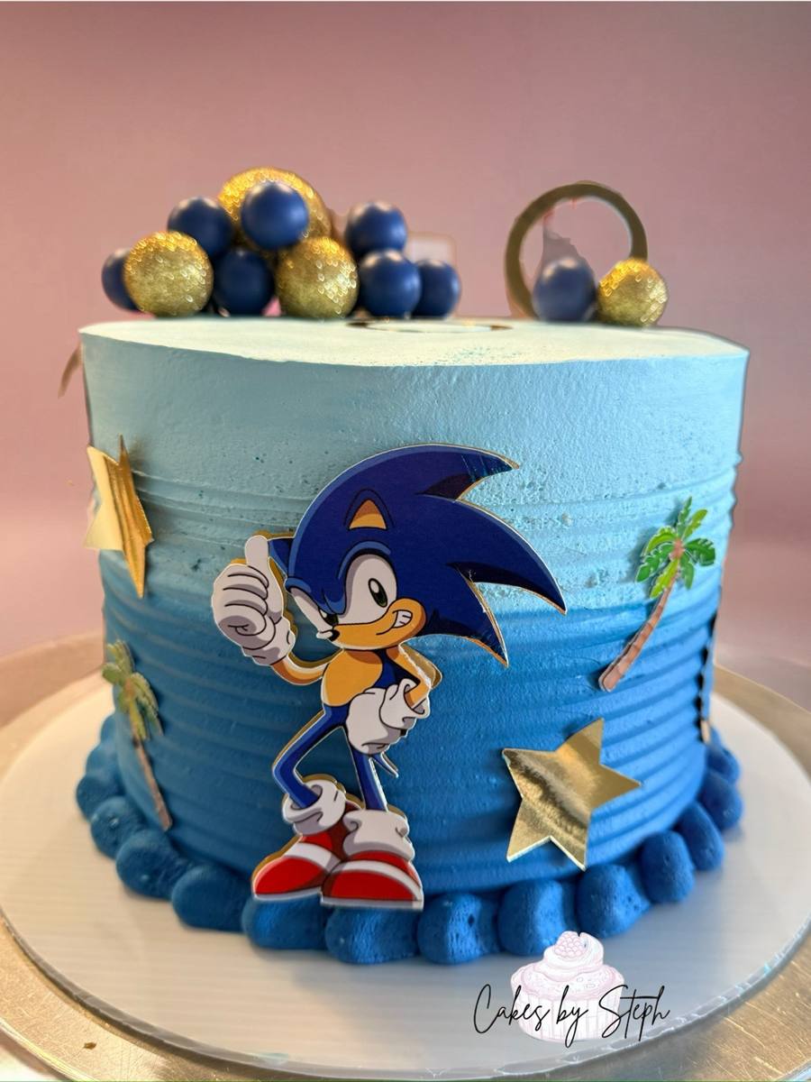 Blue ombre Sonic the Hedgehog cake with gold stars and spheres by Cakes by Steph, Leesburg VA