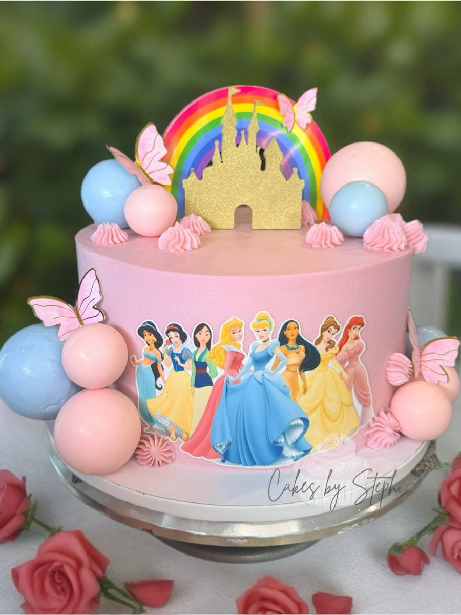 Pink Disney Princess cake with gold castle, rainbow and butterflies by Cakes by Steph, Leesburg VA
