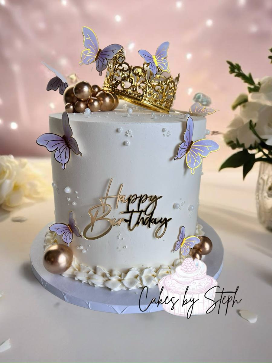 White cake, gold crown, purple butterflies, "Happy Birthday" topper by Cakes by Steph, Leesburg VA