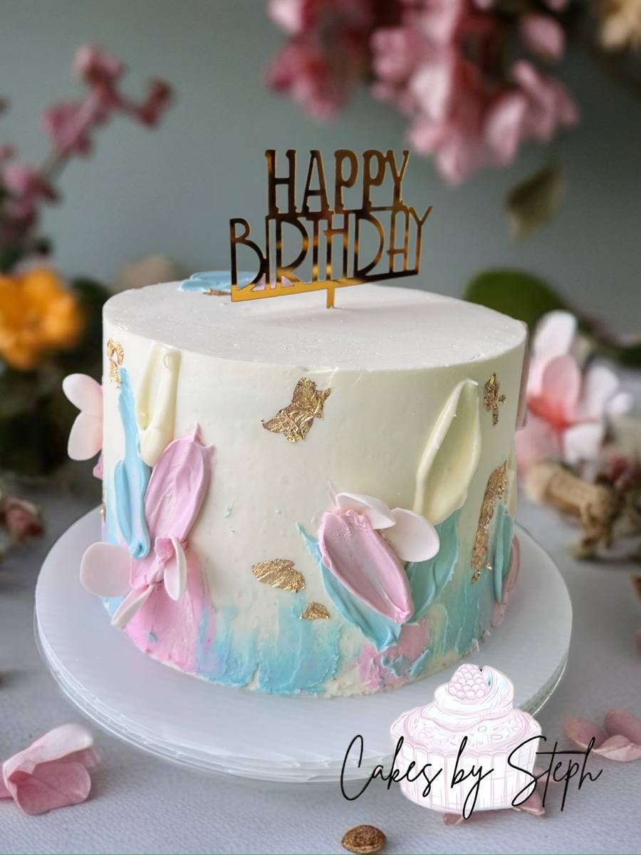 White cake with pastel pink-blue strokes, gold leaf, Happy Birthday topper by Cakes by Steph, Leesburg VA