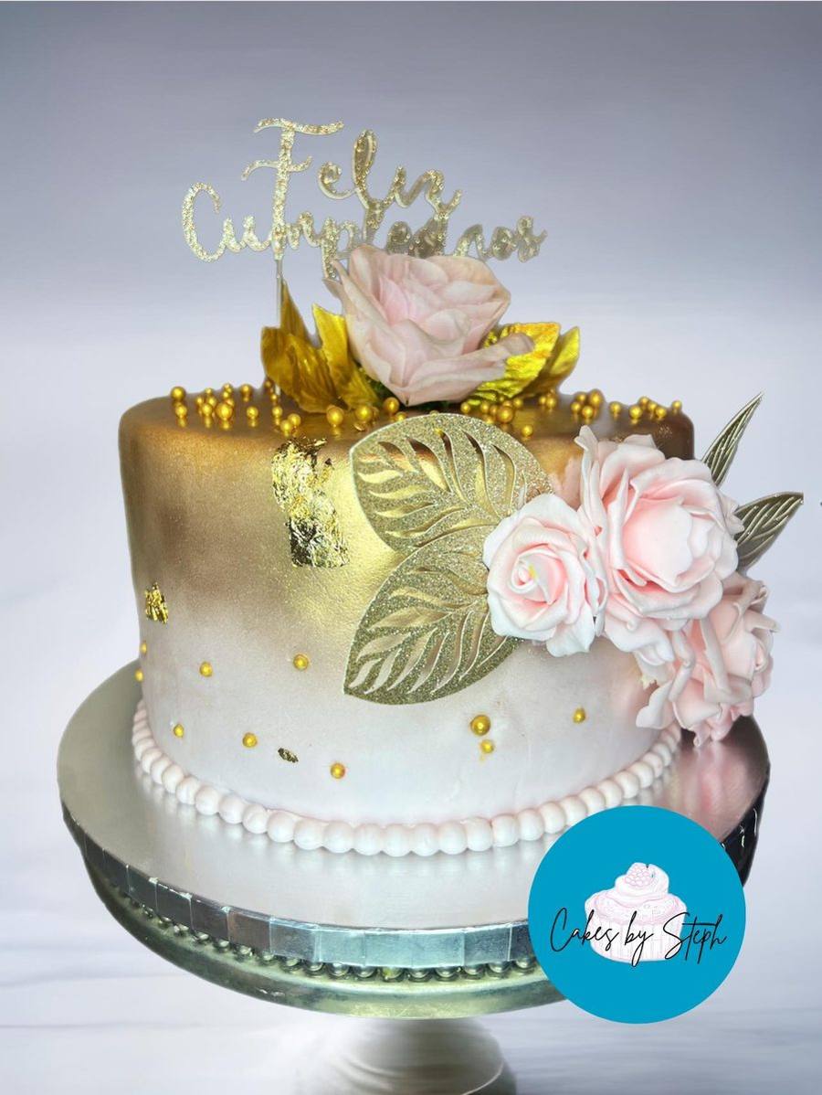 Gold and blush Feliz Cumpleanos cake with pink roses and gold leaf by Cakes by Steph, Leesburg VA