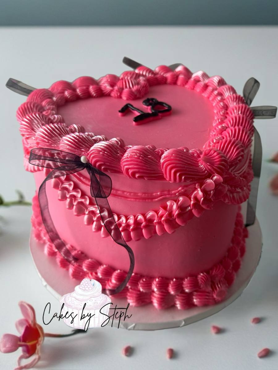 Pink vintage buttercream cake with "18" topper and sheer bow by Cakes by Steph, Leesburg VA
