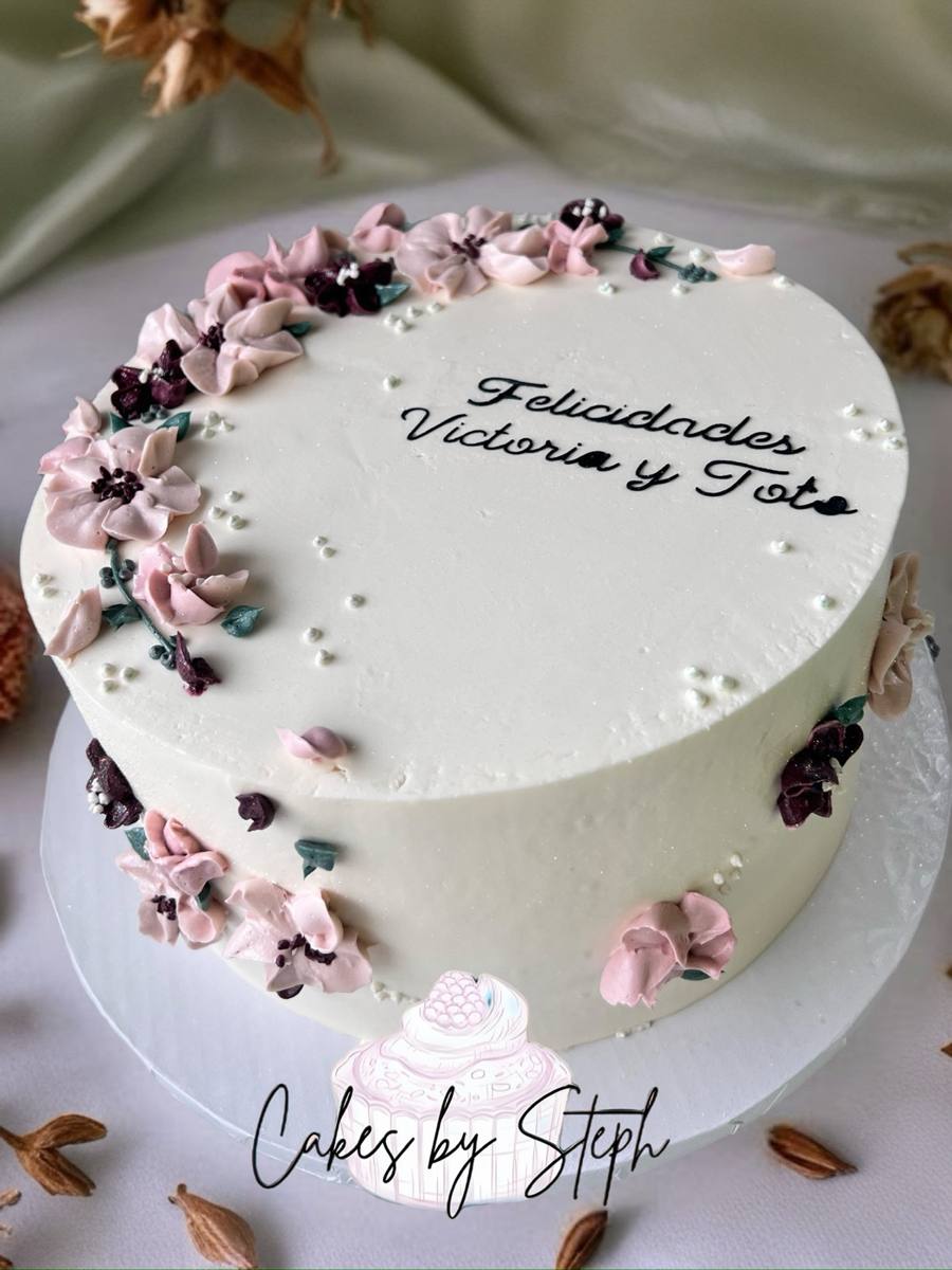 White cake with pink piped flowers, "Felicidades Victoria y Toto" by Cakes by Steph, Leesburg VA
