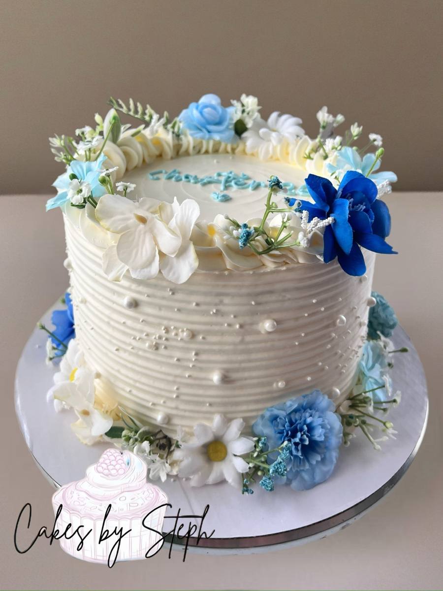 Textured white cake with blue and white flowers and pearls by Cakes by Steph, Leesburg VA