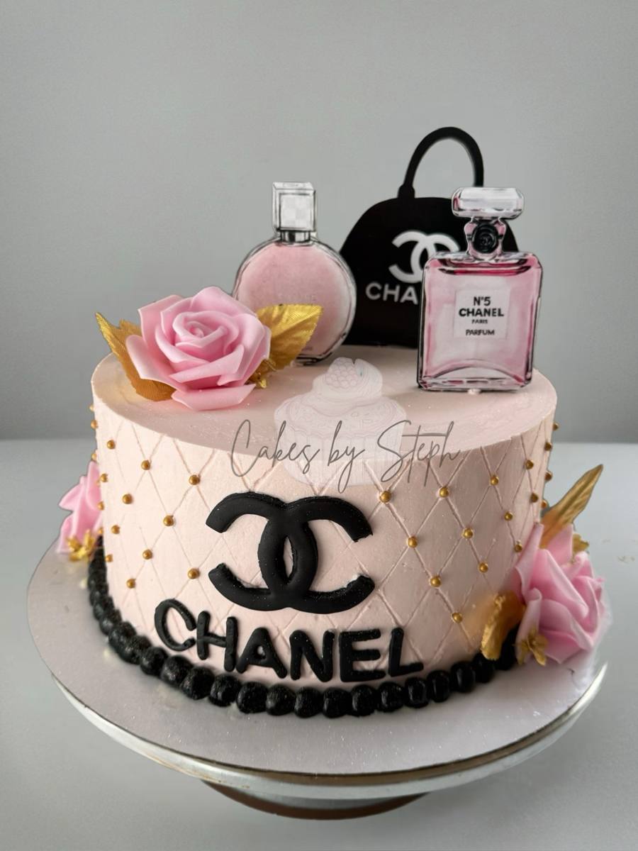Pink Chanel-themed cake with perfume, handbag toppers and roses by Cakes by Steph, Leesburg VA