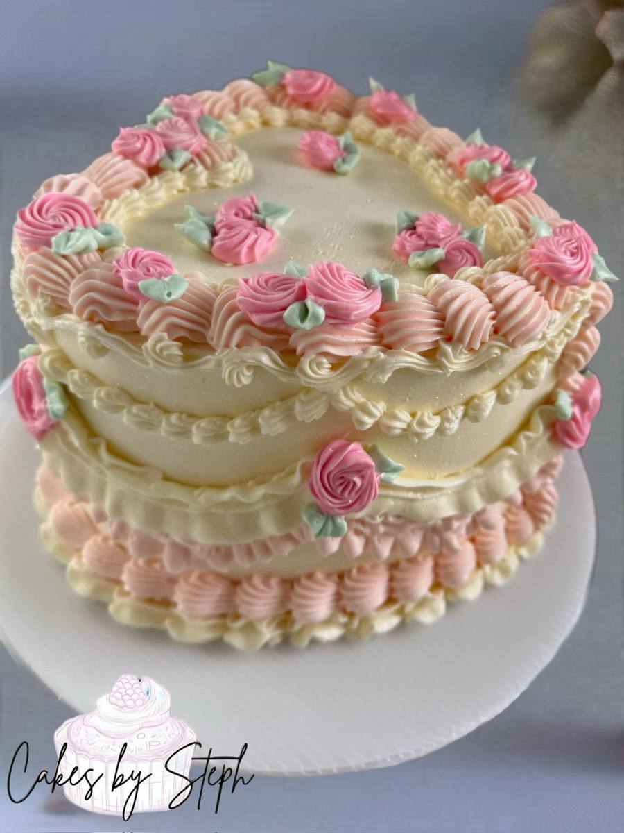 Heart-shaped ivory vintage cake with piped pink roses by Cakes by Steph, Leesburg VA
