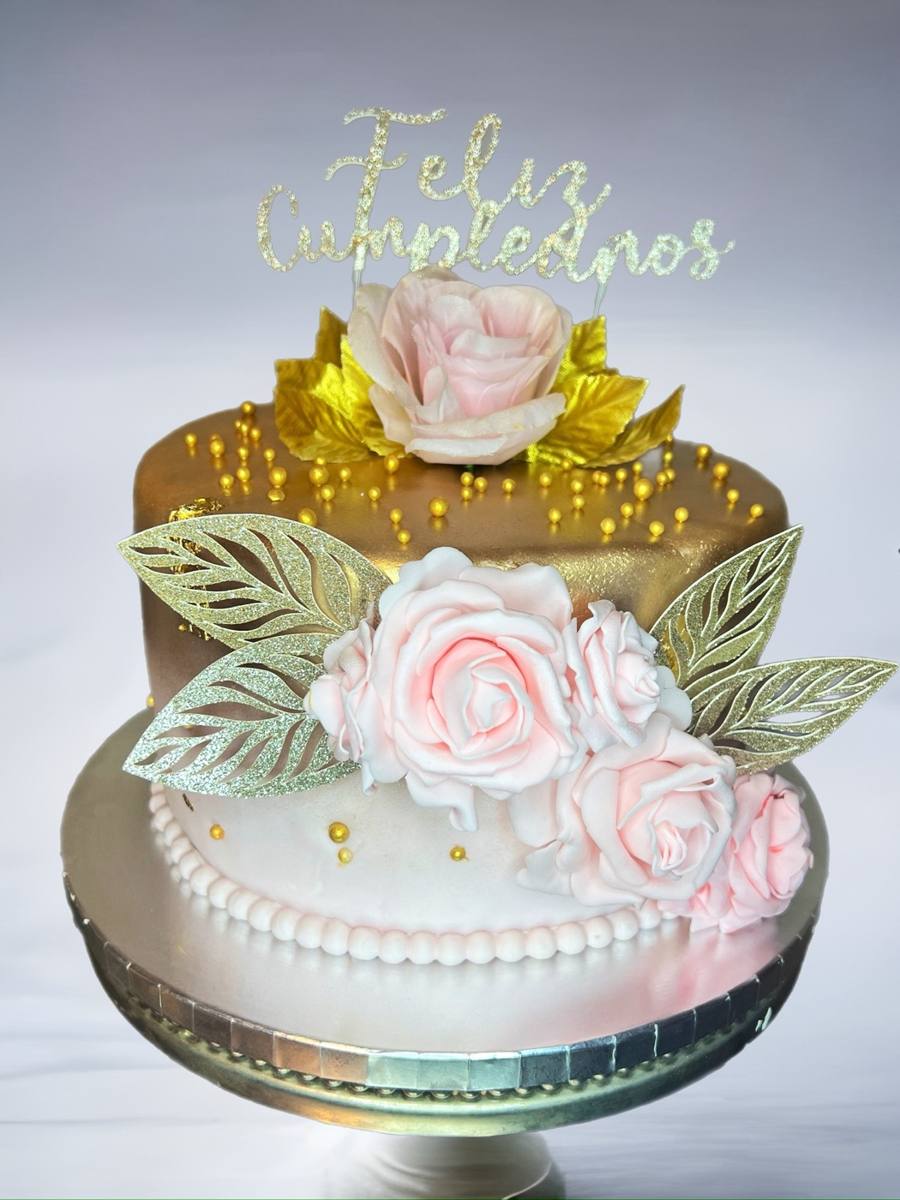 Two-tier gold and white cake, pink roses, Feliz Cumpleanos topper by Cakes by Steph, Leesburg VA