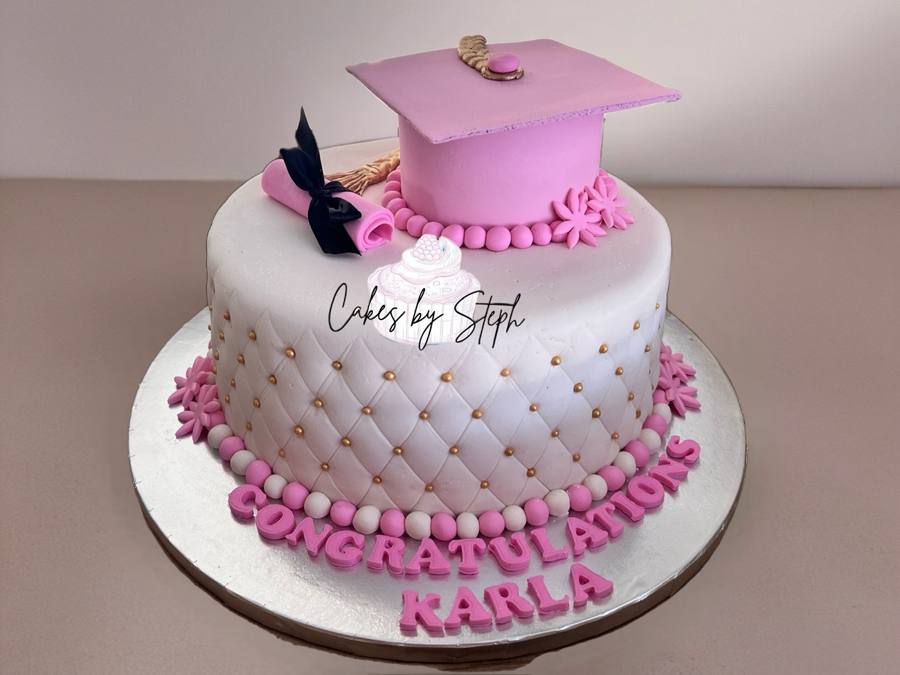 White quilted cake with pink graduation cap, diploma, "Congratulations Karla" by Cakes by Steph, Leesburg VA